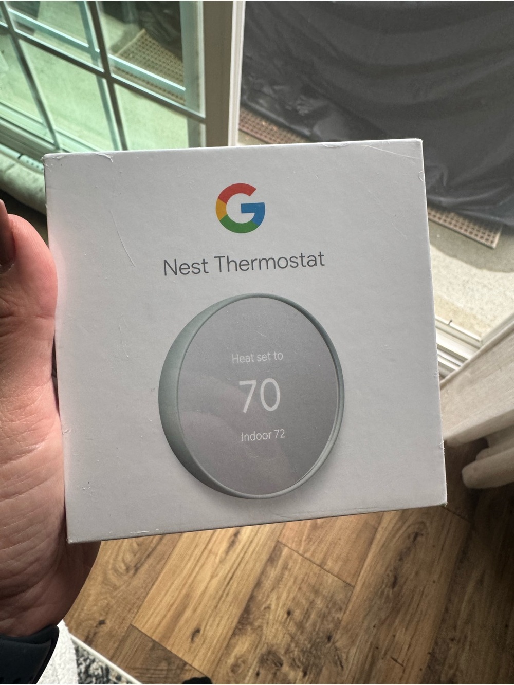google Nest Thermostat - White Packaging with Gray Device Image